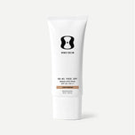 A white squeeze tube of One Skin OS-81 Face SPF Broad Spectrum SPF 30+ PA++ in Light/Medium, shown on a clean light gray background.