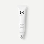 A white squeeze tube of ONE SKIN LIP SPF 15 with a silver applicator, shown against a light gray background.