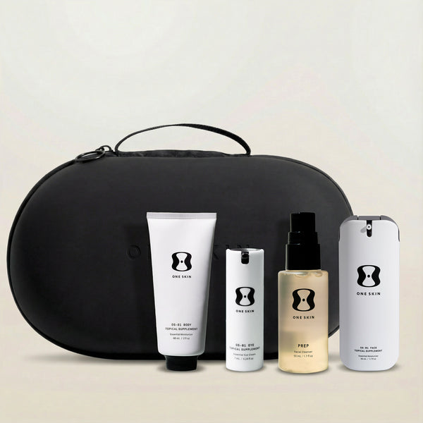 Set of skincare products with a black travel case on a light background